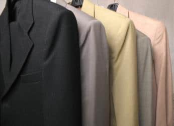 Freshly Pressed Suits Hanging | Dry Cleaning Services Columbus